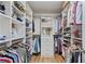 Spacious walk-in closet with built-in shelves, drawers, and hanging storage at 4016 Dover Ave, Alpharetta, GA 30009