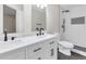 Modern bathroom with double sink vanity, black fixtures, and tiled shower at 404 Hawkstone Way, Alpharetta, GA 30022