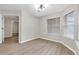 Inviting bedroom with light wood floors, lots of natural light, and a closet at 404 Hawkstone Way, Alpharetta, GA 30022