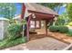 Community board showcasing local information and nestled amongst lush landscaping at 404 Hawkstone Way, Alpharetta, GA 30022