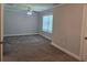 Spacious bedroom with plush carpeting, neutral walls, and a ceiling fan for added comfort at 5715 Rocky Falls Drive, Suwanee, GA 30024