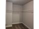 Walk-in closet features ample shelving for organization and storage at 5715 Rocky Falls Drive, Suwanee, GA 30024