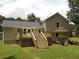 Spacious backyard featuring a large wooden deck, perfect for entertaining and outdoor relaxation at 1380 Ashbrook Dr, Lawrenceville, GA 30043