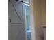 Bedroom featuring a modern sliding barn door for a unique design aesthetic at 1380 Ashbrook Dr, Lawrenceville, GA 30043