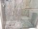 This is a close up view of the bathroom shower with hexagon flooring at 1380 Ashbrook Dr, Lawrenceville, GA 30043