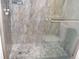 This bathroom offers a sleek glass shower with modern tiles and mosaic flooring at 1380 Ashbrook Dr, Lawrenceville, GA 30043
