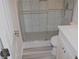 Beautiful bathroom showcasing a glass shower door, updated toilet, and white vanity at 1380 Ashbrook Dr, Lawrenceville, GA 30043