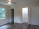 Spacious bedroom featuring modern floors, natural light, and convenient closet space at 1380 Ashbrook Dr, Lawrenceville, GA 30043