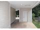 Covered carport area with access to the backyard and additional storage space at 1380 Ashbrook Dr, Lawrenceville, GA 30043