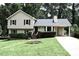 Charming home with a well-maintained front yard, driveway, and inviting curb appeal at 1380 Ashbrook Dr, Lawrenceville, GA 30043