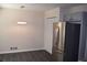Bright kitchen area with modern stainless steel refrigerator and convenient closet space at 1380 Ashbrook Dr, Lawrenceville, GA 30043