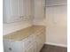 Kitchenette featuring granite counters and cabinetry, offering both style and functionality at 1380 Ashbrook Dr, Lawrenceville, GA 30043