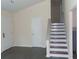 Inviting living room featuring neutral paint, staircase, and modern flooring at 1380 Ashbrook Dr, Lawrenceville, GA 30043