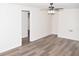 Bright living room featuring modern flooring and a ceiling fan for added comfort at 1380 Ashbrook Dr, Lawrenceville, GA 30043