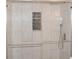 A remodeled bathroom features a frameless shower with rainfall shower head and marble style tile at 1380 Ashbrook Dr, Lawrenceville, GA 30043