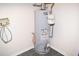 Water heater centrally located and easily accessible in the lower level of the home at 1380 Ashbrook Dr, Lawrenceville, GA 30043