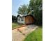 Side view of the house with a stone veneer, wood exterior, and driveway at 1422 Boulevard Se, Atlanta, GA 30315