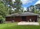 Brick home featuring a patio and backyard space, perfect for outdoor enjoyment and entertaining at 2651 Bull Run Dr, Decatur, GA 30034