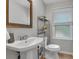 Cozy bathroom with tiled floors and a pedestal sink at 3656 Ebenezer Rd, Marietta, GA 30066