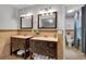 Bathroom with double vanities, two mirrors, and tile flooring at 3656 Ebenezer Rd, Marietta, GA 30066
