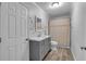 Bathroom featuring gray vanity with marble countertop and neutral shower curtain at 3656 Ebenezer Rd, Marietta, GA 30066