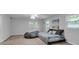 Spacious bedroom featuring neutral carpet, two windows, and a beanbag chair at 3656 Ebenezer Rd, Marietta, GA 30066