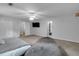 Spacious bedroom featuring neutral carpet, TV, ceiling fan, and closet at 3656 Ebenezer Rd, Marietta, GA 30066