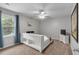 Bedroom with a white bed, neutral carpet, a ceiling fan, and natural light at 3656 Ebenezer Rd, Marietta, GA 30066