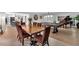 Elegant dining room features a wooden table, maroon chairs, piano, and a billiards table at 3656 Ebenezer Rd, Marietta, GA 30066