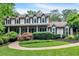 Beautiful two-story home featuring a welcoming front porch and manicured landscaping at 3656 Ebenezer Rd, Marietta, GA 30066