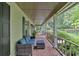 Cozy covered front porch with comfortable seating and views of the landscaped front yard at 3656 Ebenezer Rd, Marietta, GA 30066