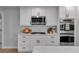 Modern kitchen features stainless steel appliances, white cabinetry and light countertops at 3656 Ebenezer Rd, Marietta, GA 30066