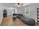 Spacious living room with wood floors, a ceiling fan, and lots of seating at 3656 Ebenezer Rd, Marietta, GA 30066
