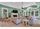 Beautiful living room with fireplace, TV, light green colored walls, and modern furniture at 3656 Ebenezer Rd, Marietta, GA 30066