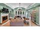 Beautiful living room with fireplace, TV, light green colored walls, and modern furniture at 3656 Ebenezer Rd, Marietta, GA 30066