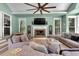 Beautiful living room with fireplace, TV, light green colored walls, and modern furniture at 3656 Ebenezer Rd, Marietta, GA 30066