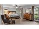 Spacious main bedroom features a ceiling fan and lots of natural light at 3656 Ebenezer Rd, Marietta, GA 30066