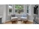 Cozy sitting area with two chairs by the window overlooking lush greenery at 3656 Ebenezer Rd, Marietta, GA 30066