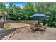 Outdoor sand volleyball court with patio seating, perfect for summer fun at 3656 Ebenezer Rd, Marietta, GA 30066