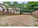 Backyard view of volleyball court and patio with attached deck and screened-in porch at 3656 Ebenezer Rd, Marietta, GA 30066