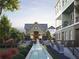 Scenic view of modern homes and a flowing water feature surrounded by colorful gardens and manicured lawns at 434 Argosy Park Cir # 13, Alpharetta, GA 30005