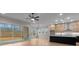 Open layout of the dining and kitchen with large windows and sliding glass door for natural light at 4770 Briscoe Dr, Cumming, GA 30028