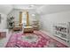 Cozy Bedroom with rocking chairs, an accent rug and a changing table at 4824 Dunwoody Station Dr, Atlanta, GA 30338