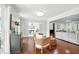 Open-concept living room with hardwood floors, large windows, and stylish decor at 4824 Dunwoody Station Dr, Atlanta, GA 30338