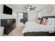 View of Primary bedroom with en suite bathroom beyond a sliding barn door, dresser and TV at 4824 Dunwoody Station Dr, Atlanta, GA 30338
