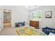 Bright playroom with play rug, chairs and table, dresser and view to outside at 4824 Dunwoody Station Dr, Atlanta, GA 30338