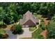 Aerial view of a brick home with an attached two-car garage and meticulously manicured garden at 17 Shotgun Nw Rd, Cartersville, GA 30121