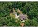 Secluded property with lush landscaping, circular drive and a patio perfect for outdoor entertaining at 17 Shotgun Nw Rd, Cartersville, GA 30121