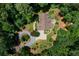 Aerial view of a brick home with an attached two-car garage and meticulously manicured garden at 17 Shotgun Nw Rd, Cartersville, GA 30121