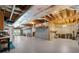 Unfinished basement featuring exposed beams, ample storage, and a walkout to the backyard at 17 Shotgun Nw Rd, Cartersville, GA 30121